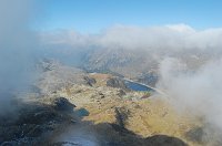 24 Panorama sulla conca del Calvi, lago dei Curiosi e diga Fregabolgia 